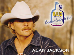 Alan Jackson 戴牛仔帽、穿牛仔衫，附有電台標誌。 — 拉馬爾·傑克遜 壁紙