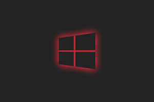 深色背景上發光的紅色Windows標誌 — MacBook Pro M4 壁紙