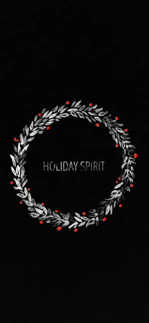 銀色花圈配紅色漿果和 holiday spirit 文字，黑色背景 — iPhone 16 Pro 壁紙