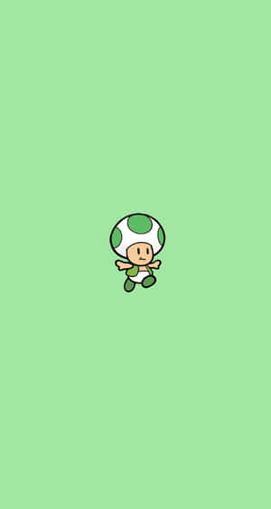 一個細小綠色蘑菇頭嘅Toad角色喺淺綠色背景上漂浮。 — Pixel Fold 壁紙