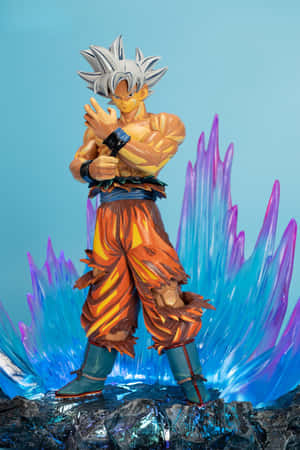 悟空超級賽亞人姿勢的動漫人偶，帶有發光的能量水晶。 — 悟空 壁紙