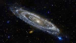 深空中帶有明亮核心和佈滿恆星旋臂的螺旋星系。 — 螢幕保護 壁紙