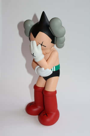 Kaws Astro Boy公仔，X形眼睛，雙手遮臉。 — 鎖定螢幕 壁紙