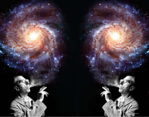男子在鏡像超現實場景中向太空呼出彩色螺旋星系。 — Astroworld GIF 壁紙