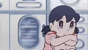 悲傷動漫女孩在白色電器前抱著自己。 — 傷心 壁紙