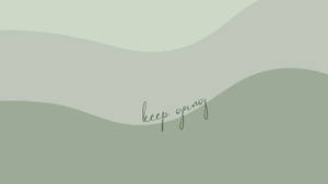 激勵語句keep going喺柔和綠色波浪背景上