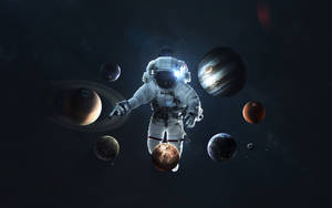 太空人在深空中漂浮於行星之間，背景有星星。 — 太空人 壁紙