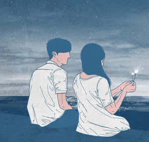 一對情侶坐在夜晚的海灘上，在星空下手持煙花棒。 — 可愛情侶 GIF 壁紙