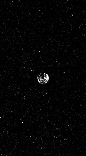 地球作為廣闊星空中的一個小行星。 — 星星 壁紙