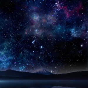 星空下的雪山與彩色星雲。 — iPad Pro 13 壁紙