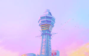 一座粉紅和紫色調的機場控制塔，鳥兒在天空中飛翔。 — 建築 壁紙