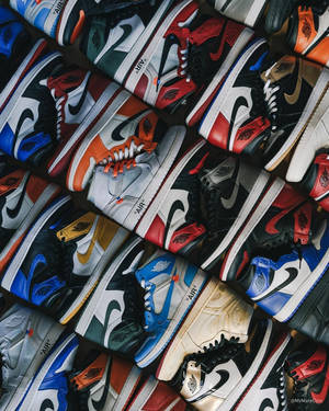 密集的彩色Nike Air Jordan運動鞋系列，款式和顏色各異。 — Jordan 標誌 GIF 壁紙