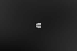Windows 標誌居中於深色漸層背景上 — MacBook Pro 14 壁紙