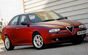 紅色Alfa Romeo 156房車停泊喺行人路近白色金屬牆。 — Steam Deck OLED 壁紙