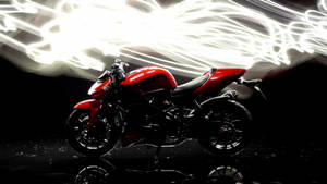 紅色Ducati電單車在反射黑色地板上留下光軌。 — 機車 壁紙