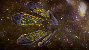 帶有發光面板的未來太空船漂浮在繁星點點的星系中。 — 質量效應 壁紙