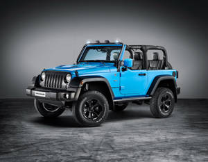 一輛藍色Jeep Wrangler，帶有黑色飾件和輪胎，在攝影棚中。 — 型格藍色動態 壁紙