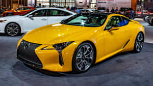 在車展上展示的一輛亮黃色Lexus跑車。 — 美學黃色 壁紙