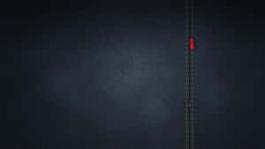 一輛紅色汽車沿著縫在深色牛仔布上的道路行駛。 — 低對比度 壁紙