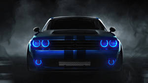 一輛在黑暗環境中被煙霧環繞的藍色發光肌肉車。 — Dodge challenger GIF 壁紙