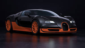 啞光黑色Bugatti Veyron，配橙色輪圈和點綴，在攝影棚燈光下。 — 模特兒 GIF 壁紙