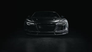 時尚的啞光黑色奧迪R8跑車在攝影棚內，配以戲劇性燈光。 — 汽車 壁紙