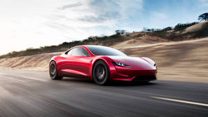 紅色跑車在日落時分的沙漠高速公路上飛馳 — Tesla GIF 壁紙