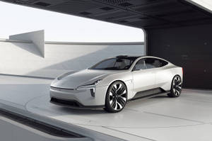 一輛銀色未來電動車停放在現代簡約車庫中。 — 汽車 壁紙