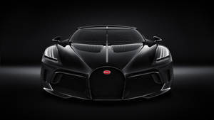黑色Bugatti Chiron超級跑車在黑暗攝影棚環境中的正面視圖。 — 布加迪 壁紙