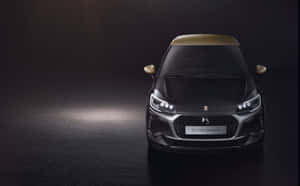 黑色DS 3 Performance汽車，帶有金色點綴，在黑暗的攝影棚中被聚光燈照亮。 — 酷車 壁紙