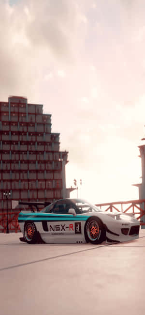 日落時分停泊在城市平台上的白色和青綠色NSX-R賽車。 — POCO X8 Pro 壁紙