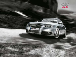 銀色 Audi 房車在山路上行駛，帶動態模糊效果。 — Audi R8 GIF 壁紙