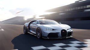 銀色Bugatti Chiron在日落時分的賽車道上越過格仔旗終點線。 — 汽車 壁紙