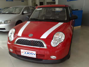 帶有白色條紋的紅色力帆汽車在展廳中 — 機車 壁紙