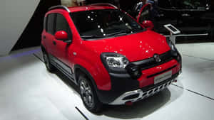 紅色菲亞特 Panda Cross SUV 在車展上敞開車門展示。 — 熊貓 壁紙