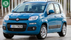 藍色Fiat Panda車泊喺濕嘅路面，背景有垂直白色板條。 — 熊貓 壁紙