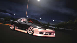 黑色和粉紅色的改裝跑車在夜間停放在街燈下。 — JDM 車 壁紙