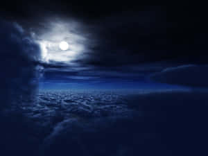 月光照亮星夜下的雲海。 — 月色夜空 壁紙
