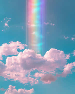 一道彩虹光束穿過粉紅色的雲朵，在夢幻的天空中閃耀。 — 唯美雲朵動態 壁紙