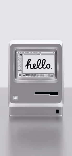 復古銀色 iMac G3 電腦在螢幕上顯示「hello」。 — Pixel 10 Pro XL 壁紙