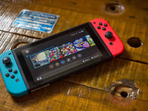 Nintendo Switch主機在木質表面上顯示遊戲庫 — PlayStation GIF 壁紙