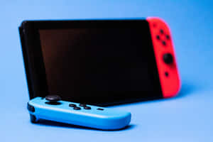 Nintendo Switch主機，帶有藍色和紅色控制器，藍色背景 — MacBook 壁紙