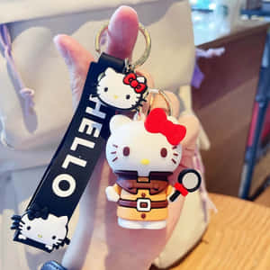手拿著Hello Kitty偵探鎖匙扣和放大鏡。 — Hello kitty 美學 GIF 壁紙