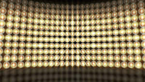 以網格圖案排列的發光金色圓形燈光牆壁。 — 風景動圖 壁紙