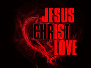 黑色背景上紅色發光文字「Jesus Christ Love」搭配旋轉的心形能量