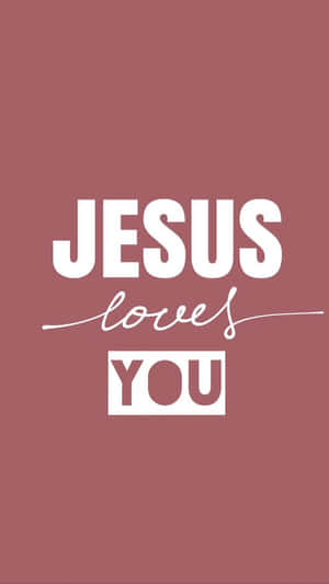 在塵粉玫瑰背景上以白色顯示「JESUS loves YOU」的文字壁紙。