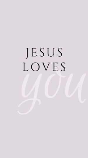 文字桌布，在薰衣草背景上以黑白顯示 'JESUS LOVES you'。