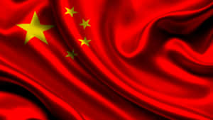 紅色布料和金色星星隨風飄揚的中國國旗。 — 中國 壁紙