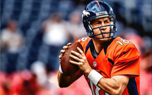 身穿橙色球衣的NFL四分衛手持橄欖球準備擲出。