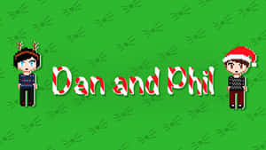 像素藝術 Dan 和 Phil 穿著節日毛衣，站在綠色背景上，帶有拐杖糖文字。